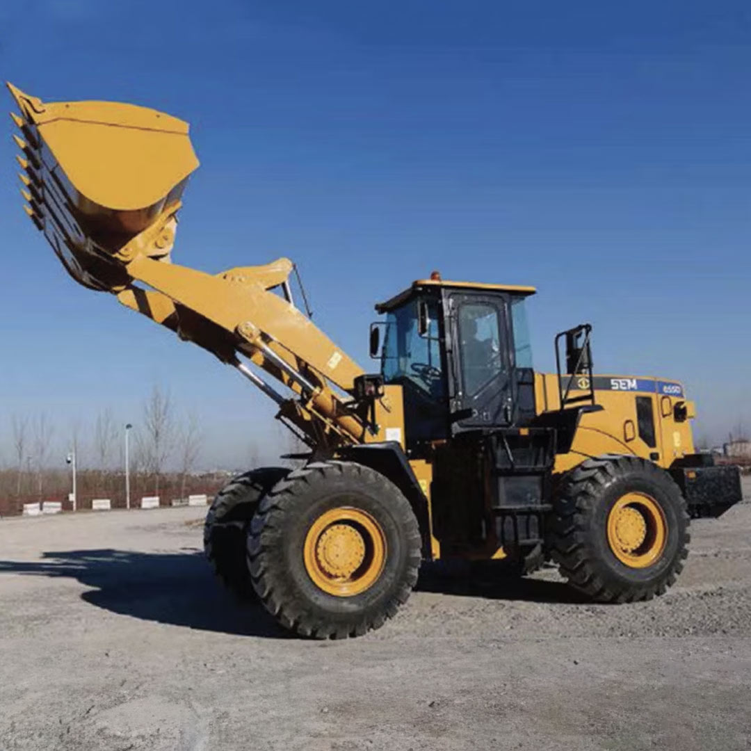 Yellow and black industrial loader with bucket